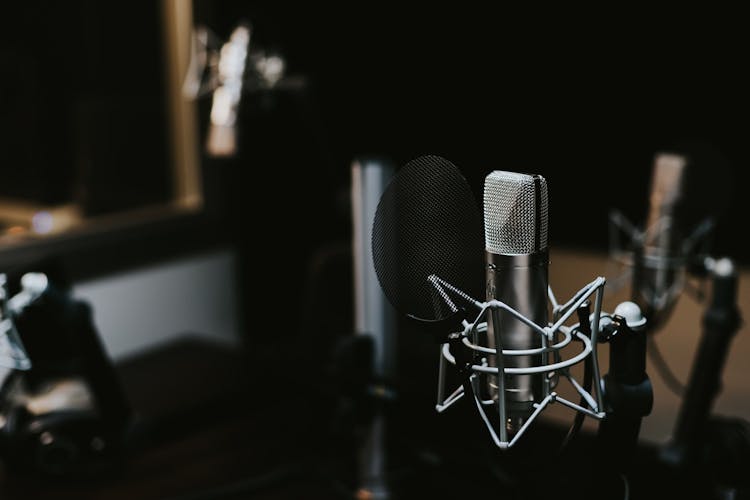Photo of a desk with podcasting equipment