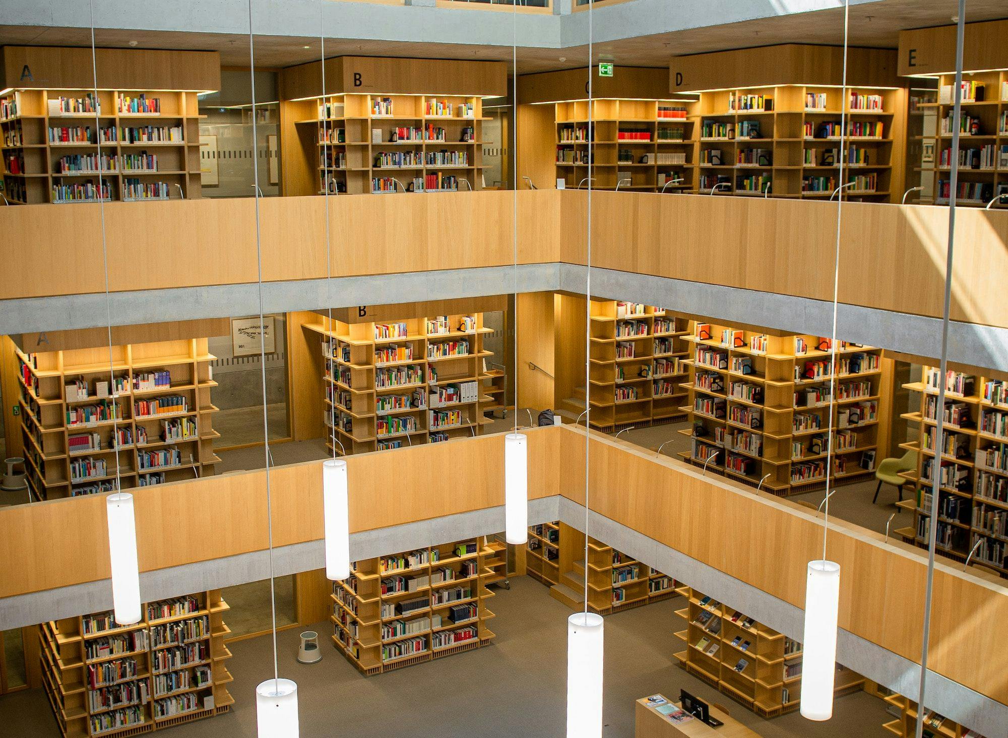 A photo of several floors of a library, with stacks of books